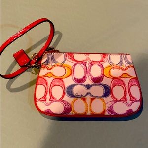 Rainbow logo Coach wristlet; never used